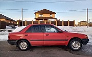 Mazda 323, 1.3 механика, 1993, седан Караганда