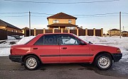 Mazda 323, 1.3 механика, 1993, седан Караганда