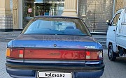 Mazda 323, 1.3 механика, 1990, седан Шымкент