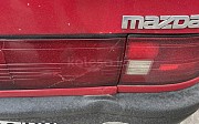 Mazda 323, 1.3 механика, 1991, седан Караганда