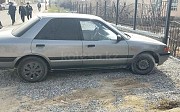 Mazda 323, 1.6 механика, 1990, седан Шымкент