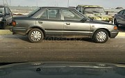 Mazda 323, 1.6 механика, 1990, седан Уральск