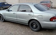 Mazda 323, 2 механика, 1999, седан Семей